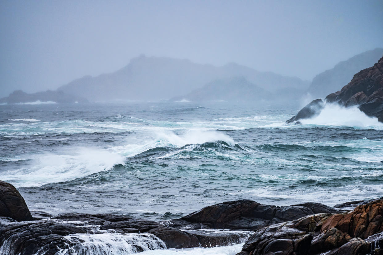 sea surface temperatures Waves crashing against cliffs during a winter storm.