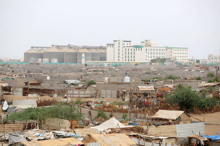 Hodeidah port's grain silos are pictured from a nearby shantytown in Hodeidah, Yemen June 16, 2018. REUTERS/Abduljabbar Zeyad