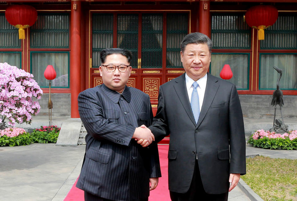 FILE - In this March 27, 2018, file photo, North Korean leader Kim Jong Un, left, shakes hands with Chinese counterpart Xi Jinping at Diaoyutai State Guesthouse in Beijing. Kim arrived in Beijing on Tuesday, Jan. 8, 2019 for his fourth summit with China’s Xi Jinping. Kim’s first foray outside of North Korea as leader was for a summit with Xi last March. The two met again in May and June, just ahead of and just after Kim’s June 12 summit with Trump in Singapore. (Korean Central News Agency/Korea News Service via AP, File)