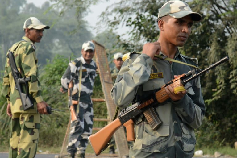 Indian Border Security Force (BSF) personnel stand guard at the India-Pakistan Wagah Border, about 35 km from Amritsar after the Punjab state government issued a warning to villagers to evacuate from a 10 km radius from the India-Pakistan border