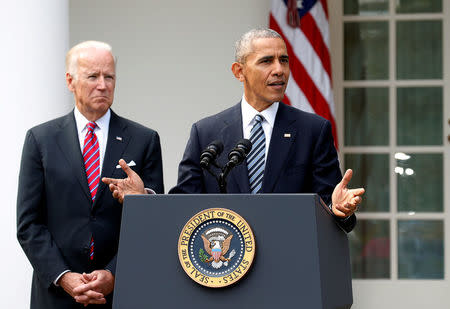 FILE PHOTO: U.S. President Barack Obama, with Vice President Joe Biden at his side, speaks about the election results that saw Donald Trump become President-elect from the Rose Garden of the White House in Washington, DC, U.S., November 9, 2016. REUTERS/Kevin Lamarque