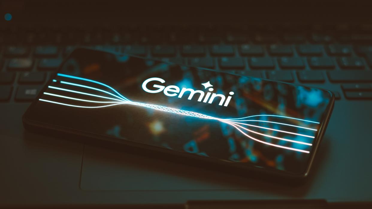  The Google Gemini logo is displayed on a smartphone screen. 