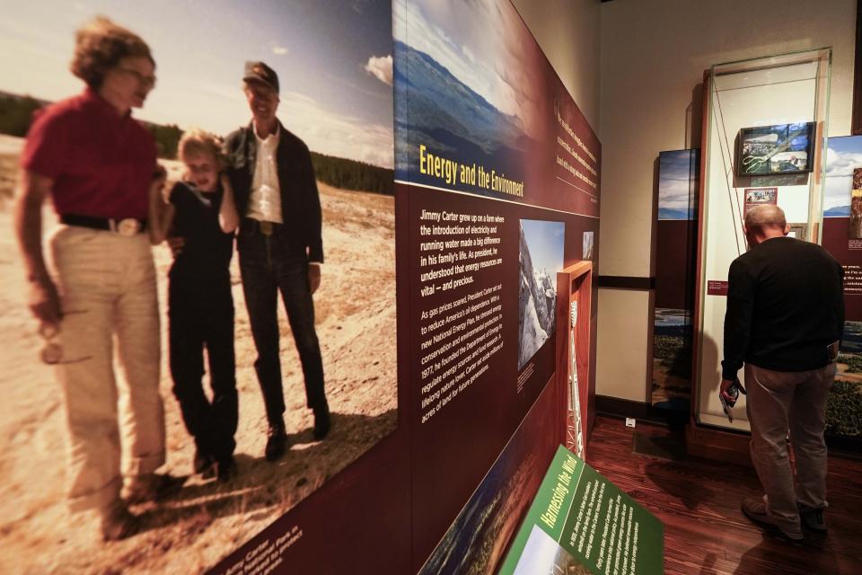 Dennison Doldolato, of Salt Lake City, Utah, looks at a display inside the Jimmy Carter National Historical Park, Monday, Nov. 20, 2023, in Plains, Ga. Rosalynn Carter, the closest adviser to Jimmy Carter during his one term as U.S. president and their four decades thereafter as global humanitarians, died Sunday, Nov. 19, 2023. She was 96. (AP Photo/Mike Stewart)