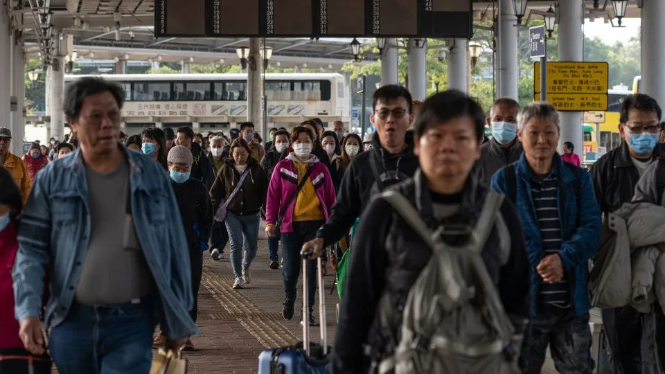People walk to the border control area as they departs to Shenzhen, from Hong Kong, China on January 21, 2024. - Noemi Cassanelli/CNN