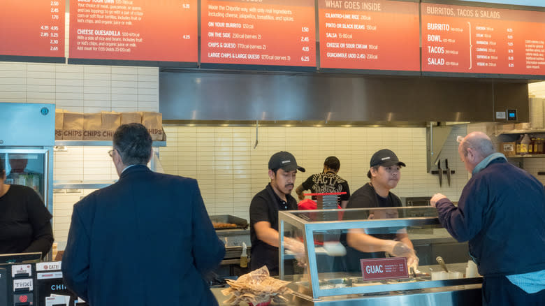 People ordering food at Chipotle Mexican Grill