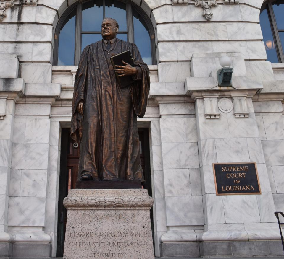 A statue of E.D. White of Thibodaux, who served as a Confederate soldier and a state and U.S. Supreme Court justice, stands in front of the Louisiana Supreme Court building in New Orleans' French Quarter before it was removed in 2020 under pressure from civil-rights activists.