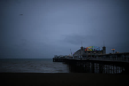 The Brighton Palace Pier sign is illuminated with rainbow colours in Brighton, Britain March 5, 2019. REUTERS/Clodagh Kilcoyne