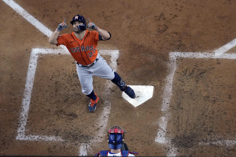 Houston Astros' Jose Altuve celebrates after hitting a home run against the Texas Rangers during the third inning in Game 3 of the baseball American League Championship Series Wednesday, Oct. 18, 2023, in Arlington, Texas. (AP Photo/Godofredo A. Vasquez)