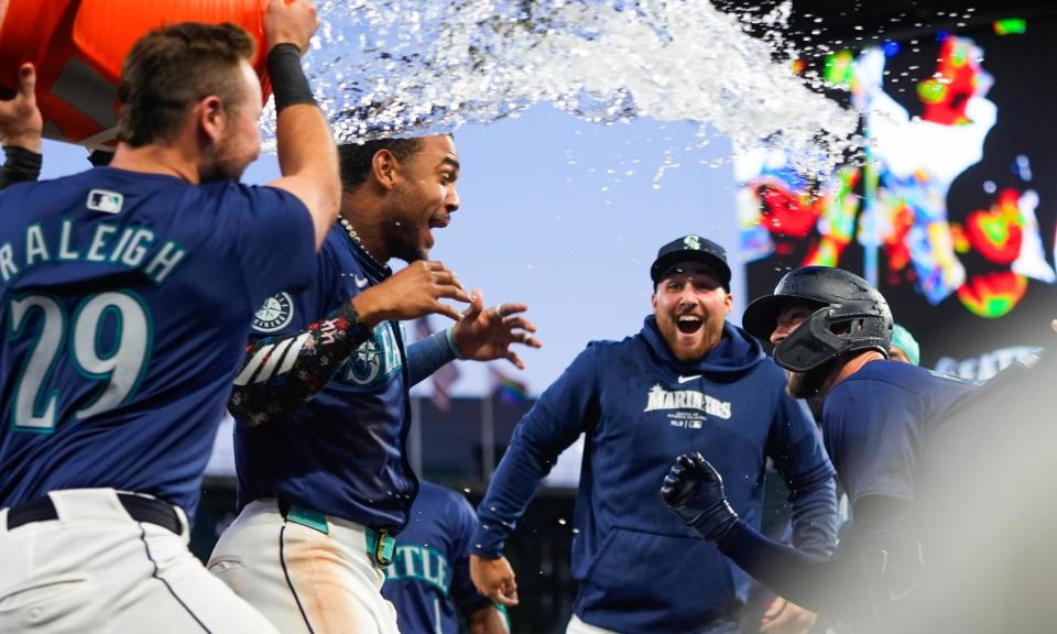 <span>The Mariners celebrate an extra inning victory over the <a class="link " href="https://sports.yahoo.com/mlb/teams/chi-white-sox/" data-i13n="sec:content-canvas;subsec:anchor_text;elm:context_link" data-ylk="slk:White Sox;sec:content-canvas;subsec:anchor_text;elm:context_link;itc:0">White Sox</a> earlier this season. </span><span>Photograph: Lindsey Wasson/AP</span>