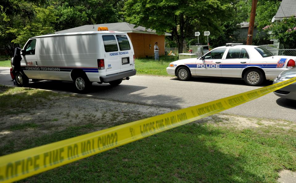 Homicide detectives and forensic crime scene technicians process the scene of a homicide at 334 Rhew Street on May 31, 2010. A former Fort Bragg soldier was arrested in Texas on Tuesday, Feb. 7, 2023, in the killing of Terrance Omar Plummer Jr.