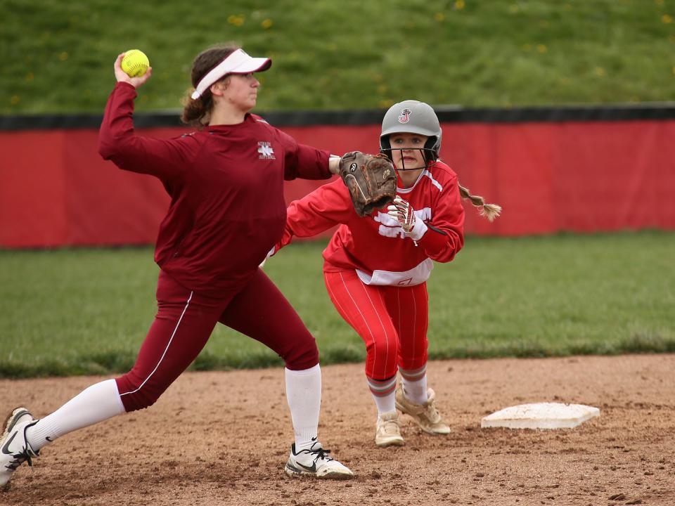 Johnstown's Brooklynne Siegel leads off of second base and keeps an eye on Newark's Paige Simons as she throws to first during the host Johnnies' 15-8 victory on Saturday, April 6, 2024.