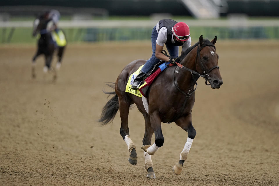 Kentucky Derby entrant Helium works out at Churchill Downs Wednesday, April 28, 2021, in Louisville, Ky. The 147th running of the Kentucky Derby is scheduled for Saturday, May 1. (AP Photo/Charlie Riedel)