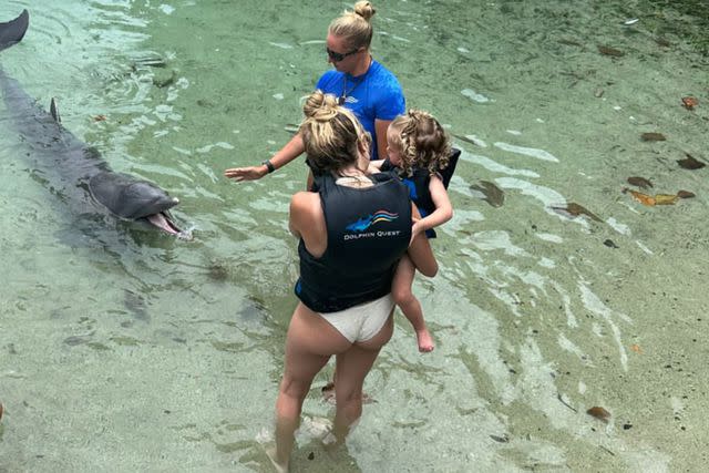 <p>Instagram/brittanylynne</p> Brittany Mahomes bringing daughter Sterling to meet the dolphins.