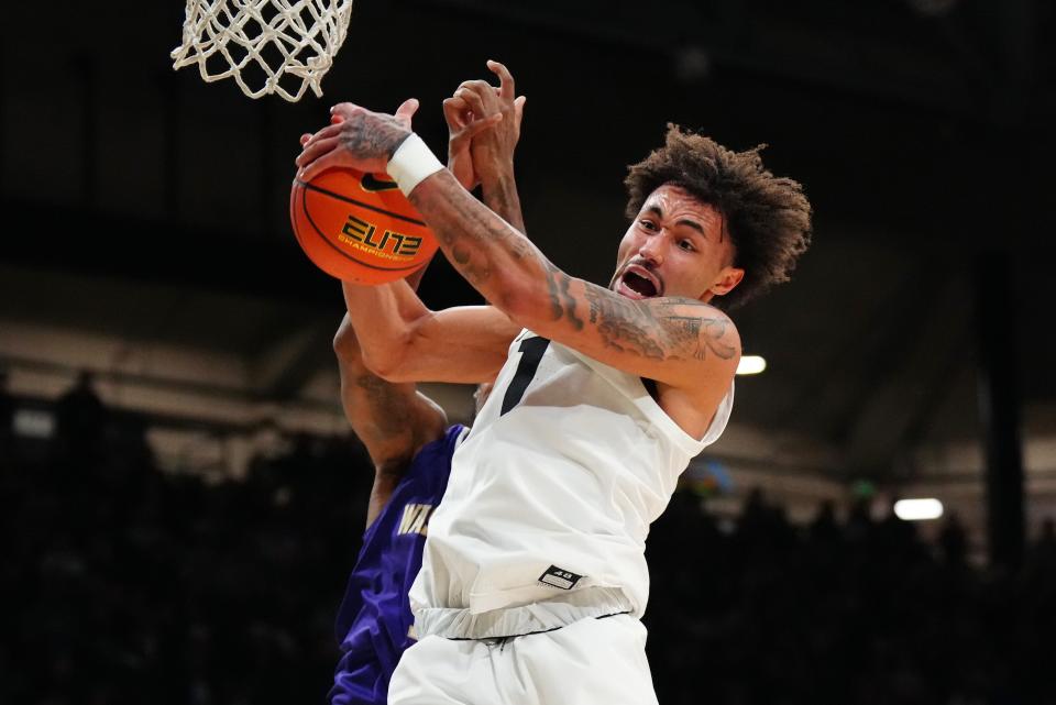 Dec 29, 2023; Boulder, Colorado, USA; Colorado Buffaloes guard J'Vonne Hadley (1) pulls a rebound in the first half against the Washington Huskies at the CU Events Center. Mandatory Credit: Ron Chenoy-USA TODAY Sports