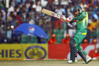 Bangladesh's Mushfiqur Rahim plays a shot during the Asia Cup one-day international cricket tournament against India in Fatullah, near Dhaka, Bangladesh, Wednesday, Feb. 26, 2014. (AP Photo/A.M. Ahad)