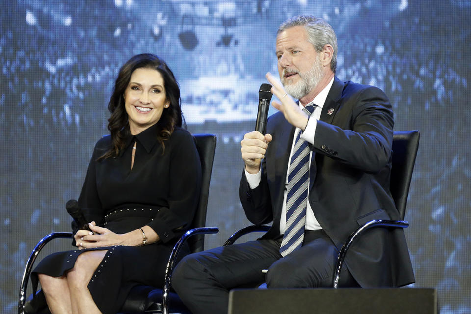 Corrects to Becki not Becky - FILE -This Wednesday Nov. 28, 2018 file photo shows Rev. Jerry Falwell Jr., right, and his wife, Becki during after a town hall at a convocation at Liberty University in Lynchburg, Va. Falwell Jr. says he is seeking help for the 