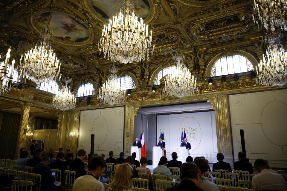 Polish President Andrzej Duda , left, French President Emmanuel Macron, center, and German Chancellor Olaf Scholz attend a joint press conference Monday, June 12, 2023 at the Elysee palace in Paris. Emmanuel Macron, German Chancellor Olaf Scholz and Polish President Andrzej Duda meet in Paris for talks focusing on military support for Ukraine's counteroffensive and future security guarantees to be given to the country, ahead of a NATO summit in July. (Sarah Meyssonnier , Pool via AP)