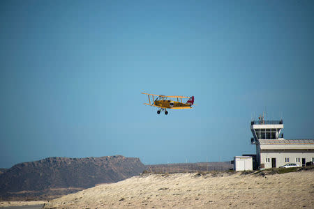 British pilots John Baxter from Sheffield and Norman Perry from Swindon take off on a biplane representing Britain during the start of the Vintage Air Rally over the airport of Sitia on the island of Crete, Greece, November 11, 2016. Vintage Air Rally/Beatrice de Smet/Handout via REUTERS