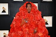<p>We love a good monochromatic moment—especially when the person goes all in. Lizzo's makeup and nails shows her commitment to the look. Kudos to her nail artist for these orange stiletto floral nails that perfectly match her dress. </p>