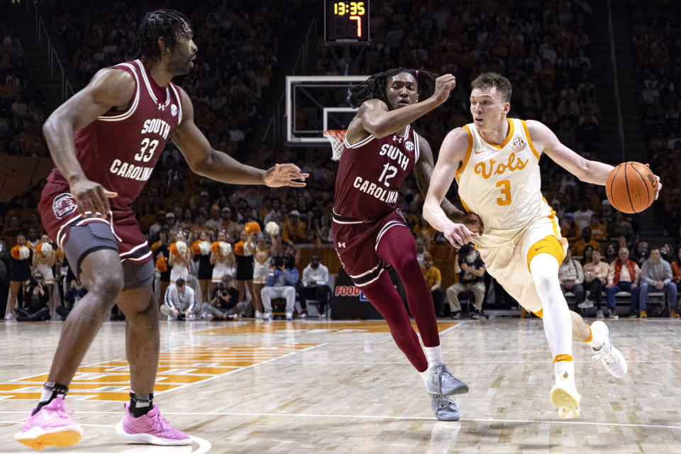 Tennessee guard Dalton Knecht (3) drives against South Carolina guard Zachary Davis (12) during the first half of an NCAA college basketball game Tuesday, Jan. 30, 2024, in Knoxville, Tenn. (AP Photo/Wade Payne)