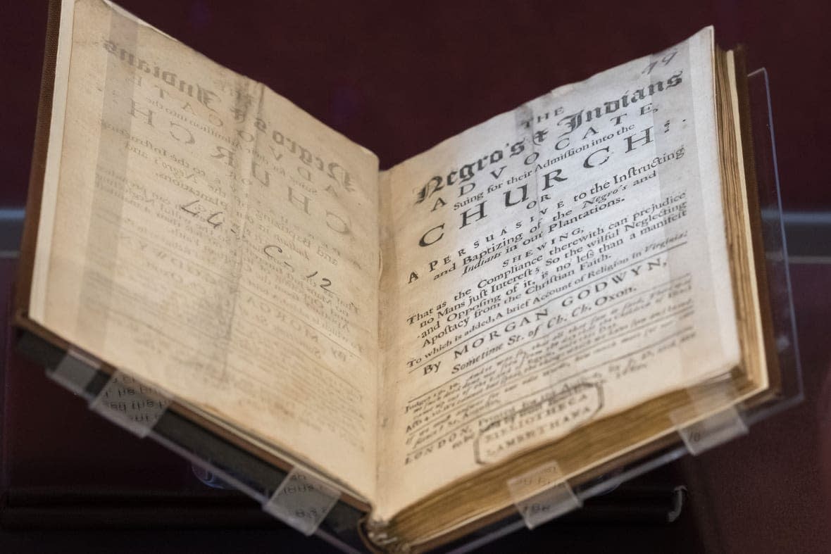 A book written in 1680 by Anglican clergyman Morgan Godwyn, who argued endorsing the slave trade amounted to making a deal with the Devil, is displayed at the exhibition in the Lambeth Palace Library, in London, Tuesday, Jan. 31, 2023. (AP Photo/Kin Cheung)