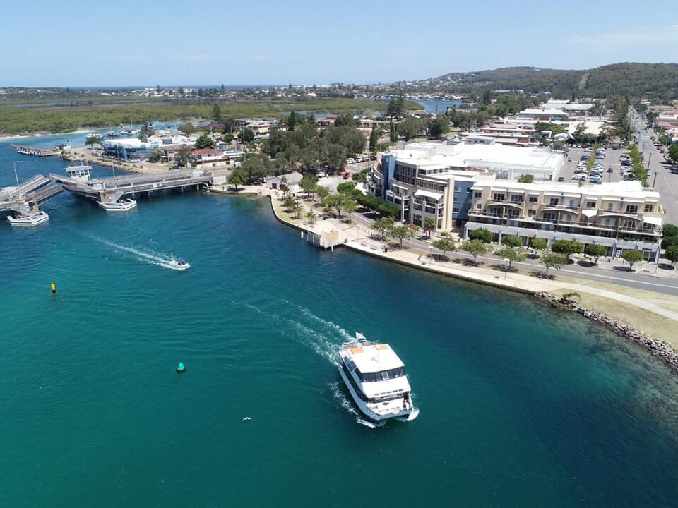 A river cruise is seen on the water in Lake Macquarie