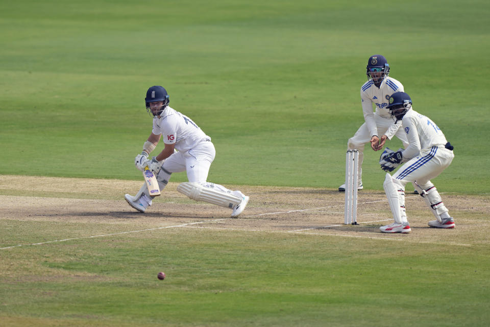 England's Ben Duckett, left, plays a shot on the third day of the first cricket test match between England and India in Hyderabad, India, Saturday, Jan. 27, 2024. (AP Photo/Mahesh Kumar A.)