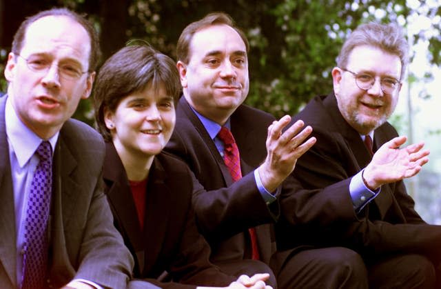In 1999, Ms Sturgeon was SNP vice convenor. Seen here with party colleagues, from left, deputy convenor John Swinney, party leader Alex Salmond and chief executive Mike Russell after the Scottish parliamentary elections of 1999 (PA) 