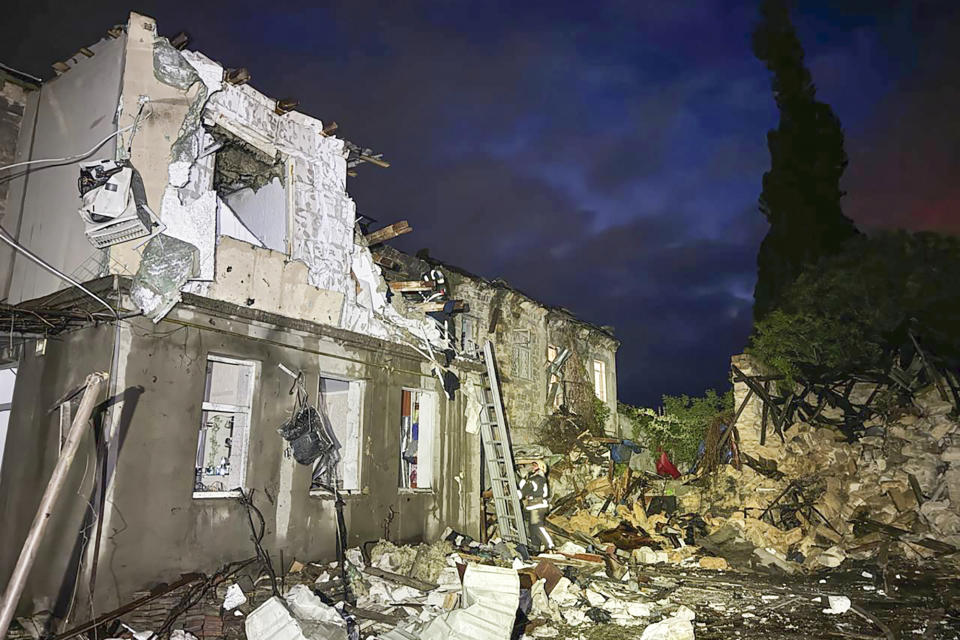 This photo, provided by head of the Odesa Regional Military Administration Oleh Kiper, firefighters work on the site of a damaged building after a Russian drone attack in Odesa, Ukraine, Tuesday, April 23, 2024. (Head of the Odesa Regional Military Administration Oleh Kiper via AP)