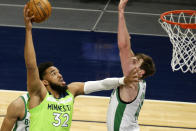 Minnesota Timberwolves center Karl-Anthony Towns (32) shoots over Boston Celtics center Luke Kornet (40) in the first quarter during an NBA basketball game, Saturday, May 15, 2021, in Minneapolis. (AP Photo/Andy Clayton-King)