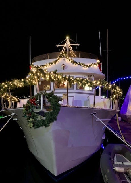 A boat is decked out in Christmas decor in Newport Harbor.