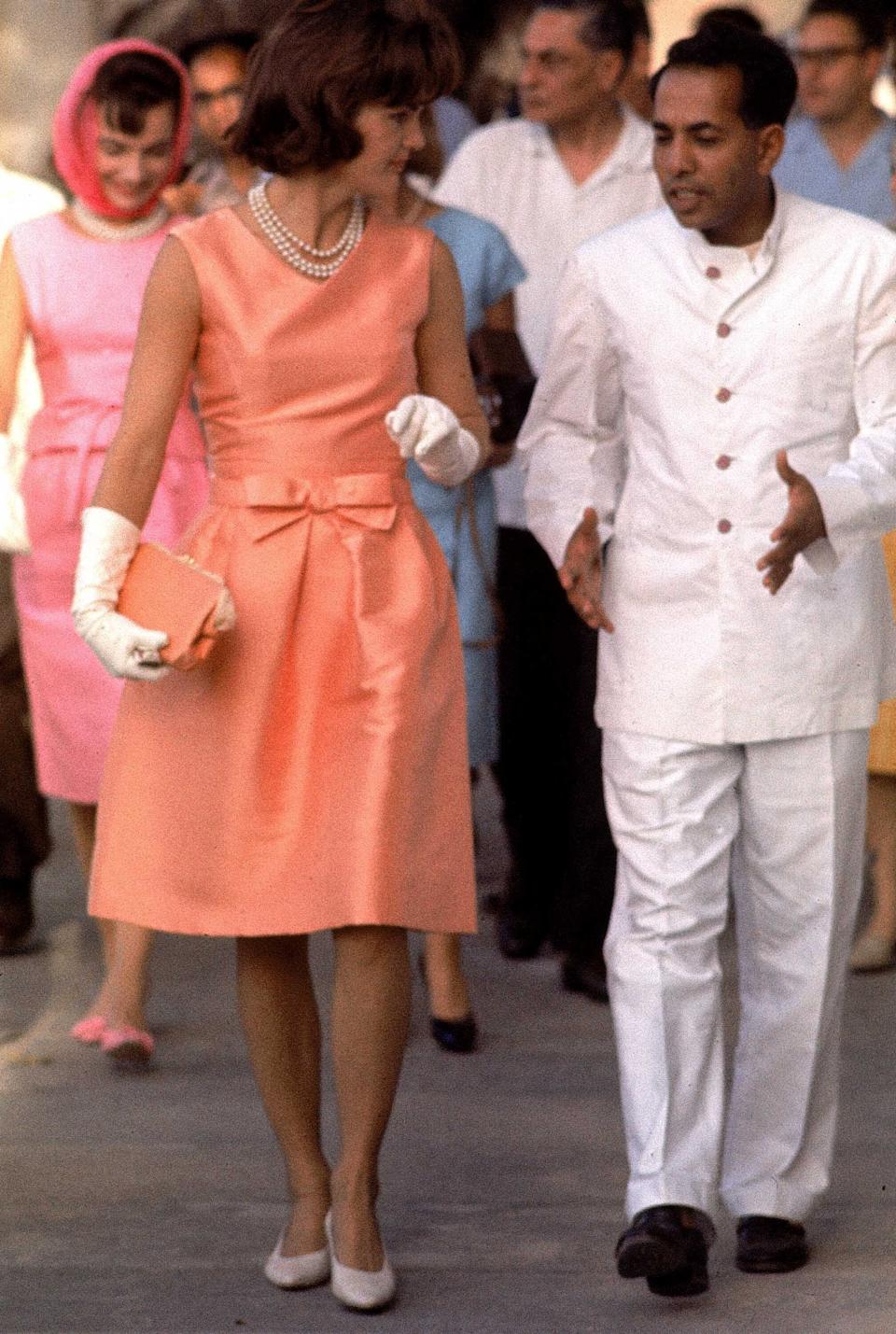 Kennedy walks during a visit with the Maharaja of Mewar.