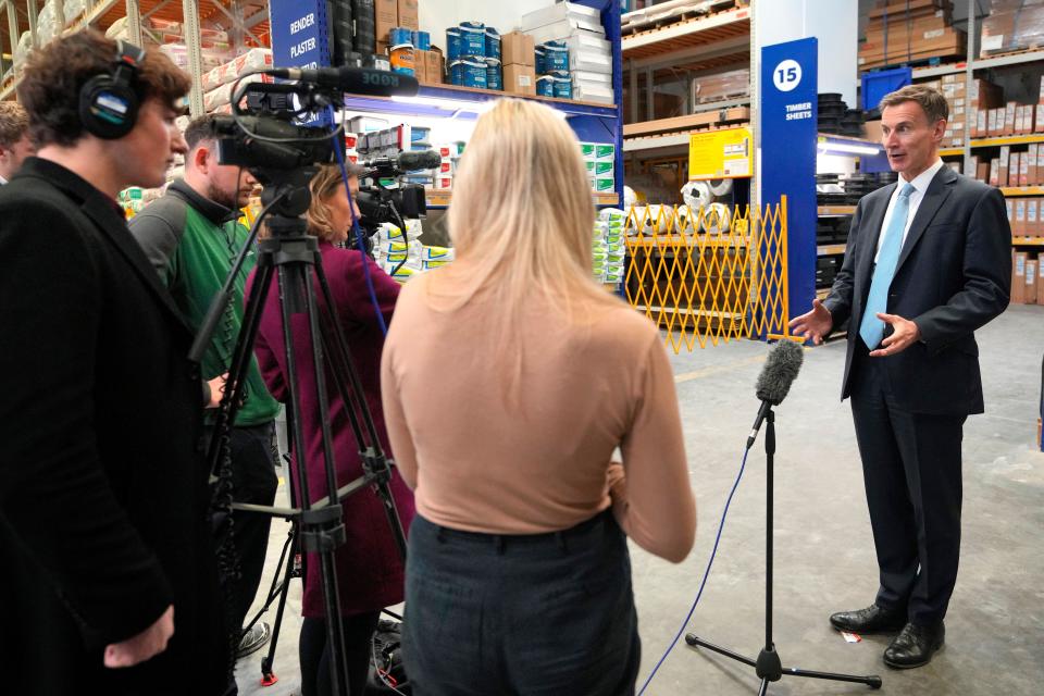 national insurance Britain's Chancellor Jeremy Hunt speaks to TV reporters during a visit to a builders warehouse in London, Wednesday, March 6, 2024. The Chancellor earlier Wednesday delivered the annual Budget to the House of Commons . (AP Photo/Kirsty Wigglesworth, pool)