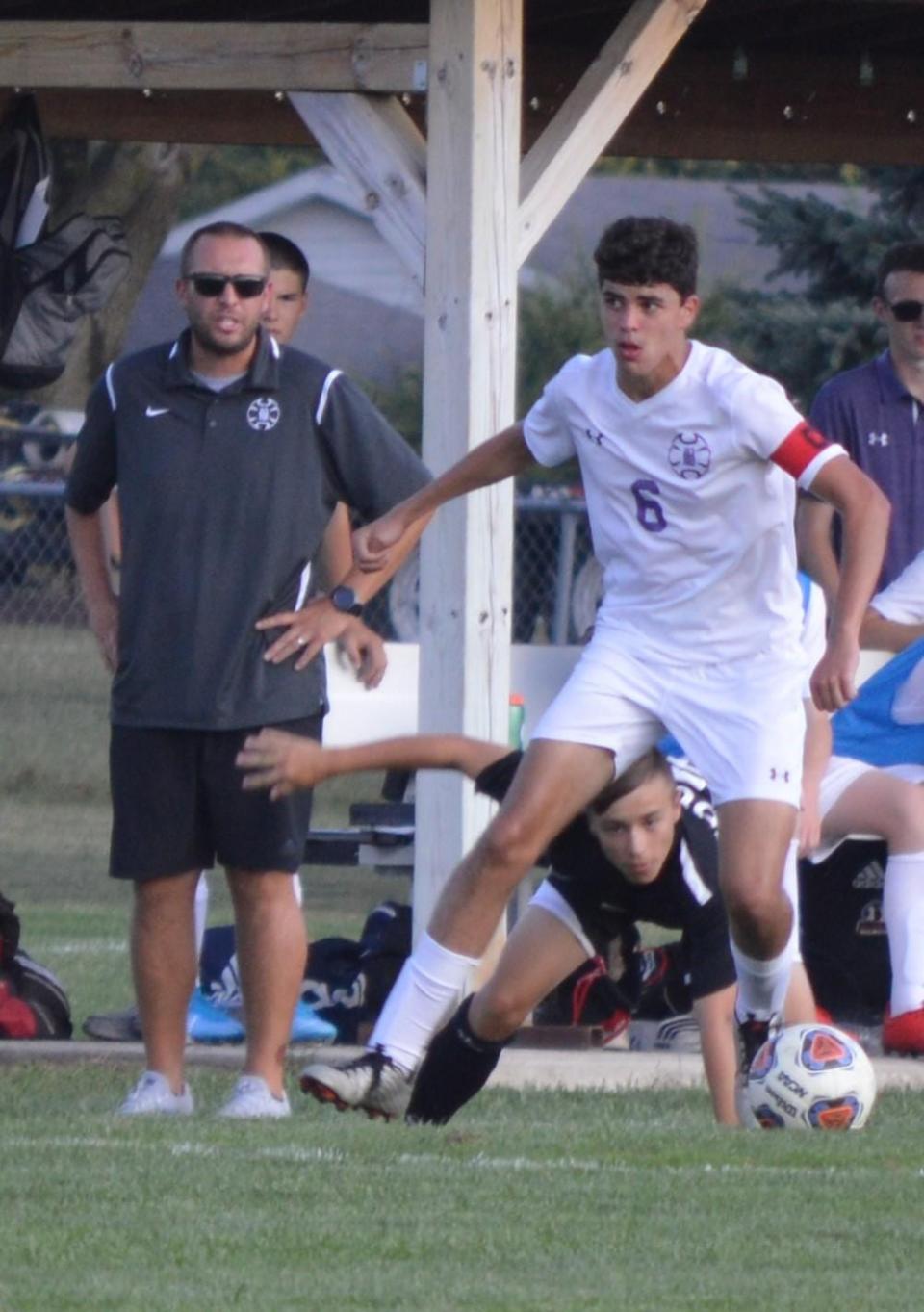 Corbin Calvert (left) looks on during a Bloomington South boys soccer game. Calvert was promoted to Panthers head coach ahead of the 2022 season.