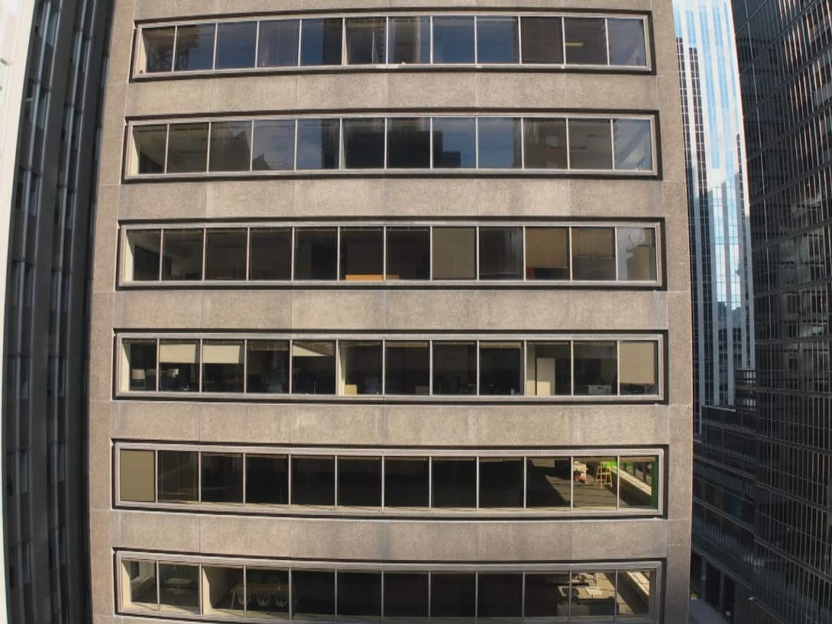 This mid-rise office tower in downtown Toronto, photographed with a wide-angle lens, is the type of building that could be strong candidate for converting to residential because it's not too old, not too big and has many windows.  (Patrick Morrell/CBC - image credit)