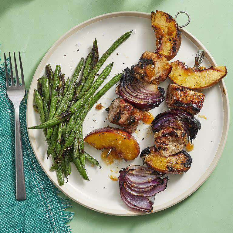 <p>This unexpected combo of pork and peach is juicy and delicious. Just throw these skewers on the grill, and you'll have a flavorful dinner in no time. </p><p><em><a href="https://www.womansday.com/food-recipes/food-drinks/a28354249/pork-and-peach-kebabs-with-grilled-green-beans-recipe/" rel="nofollow noopener" target="_blank" data-ylk="slk:Get the Pork and Peach Kebabs with Grilled Green Beans recipe.;elm:context_link;itc:0;sec:content-canvas" class="link ">Get the Pork and Peach Kebabs with Grilled Green Beans recipe. </a></em></p>