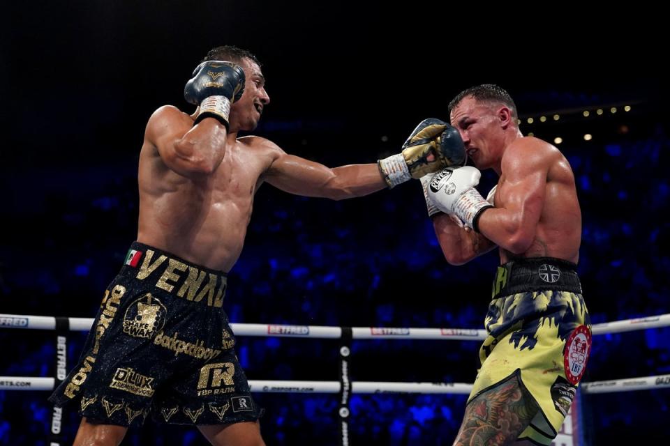 Luis Alberto Lopez (left) and Josh Warrington in action in their IBF featherweight world title fight (Tim Goode/PA) (PA Wire)