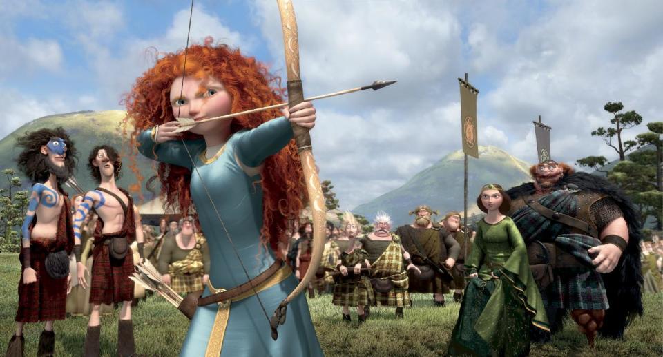 This film image released by Disney/Pixar shows the character Merida, voiced by Kelly Macdonald, in a scene from "Brave." The top spot at the box office is rare turf for Kelly Macdonald, a character actress known on the big-screen mainly for supporting roles in such films as "No Country for Old Men" and "Finding Neverland." With her wild red mane and her killer skills with sword and bow, Macdonald has become the latest in Hollywood's growing line of successful female action heroes. (AP Photo/Disney/Pixar)