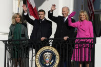 President Joe Biden and first lady Jill Biden with French President Emmanuel Macron and his wife Brigitte Macron wave from the Blue Room Balcony during a State Arrival Ceremony on the South Lawn of the White House in Washington, Thursday, Dec. 1, 2022. (AP Photo/Alex Brandon)