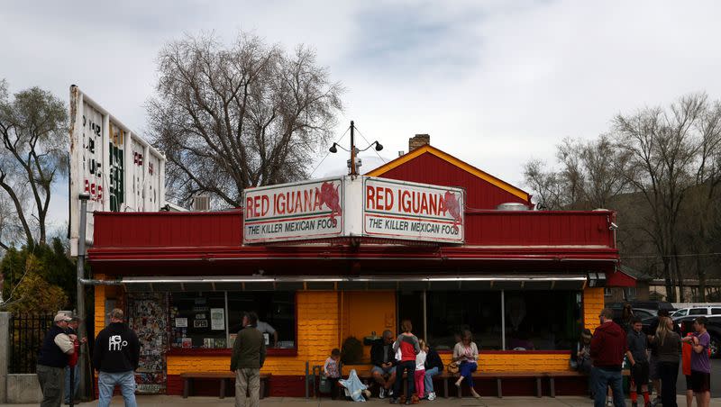 People wait to be seated at Red Iguana on Friday, April 5, 2013.