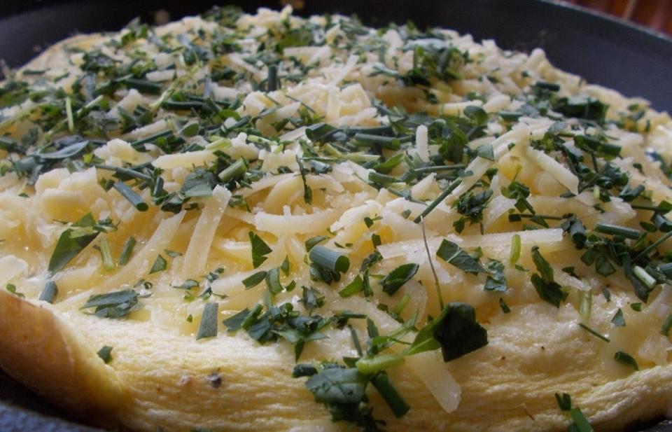 Classic frittata with cheese and herbs