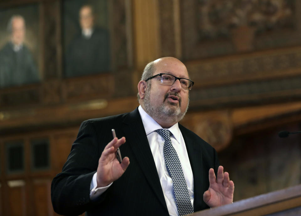 Attorney Steven Schlesinger argues that a Holocaust survivor Riven Flamenbaum's family be able to keep an ancient gold tablet that their late father somehow obtained in Germany after World War II, on Tuesday, Oct. 15, 2013, at the New York State Court of Appeals in Albany, N.Y. Schlesinger argued that Flamenbaum's estate has a legal claim, whether he bought the relic from a Russian soldier whose government authorized pillaging or simply took it to compensate for losing his family at the Auschwitz concentration camp. (AP Photo/Mike Groll)