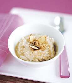 Cinnamon-Almond Rice Pudding is versatile enough to make a welcome breakfast, dessert or snack, topped with almonds and a drizzle of honey.