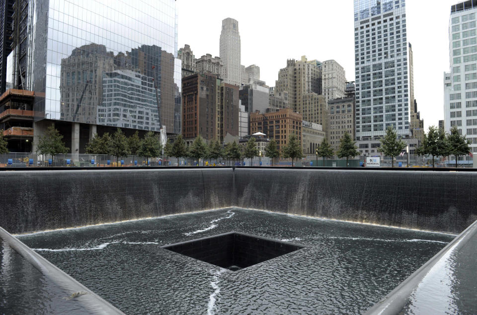 FILE - In this Sept. 6, 2011 file photo, the World Trade Center North Tower memorial pool at the National September 11 Memorial and Museum is seen against the New York City skyline. The foundation that runs the memorial estimates that once the roughly $700 million project is complete, it will cost $60 million a year to operate. (AP Photo/Susan Walsh, Pool, File)