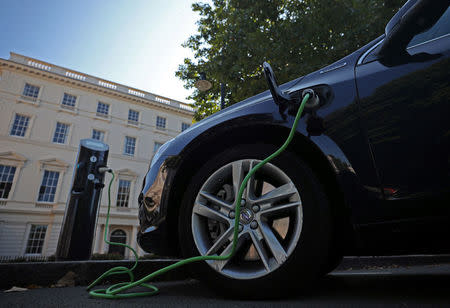 A Volvo hybrid car is seen connected to a charging point in London, Britain September 1, 2017. REUTERS/Hannah McKay