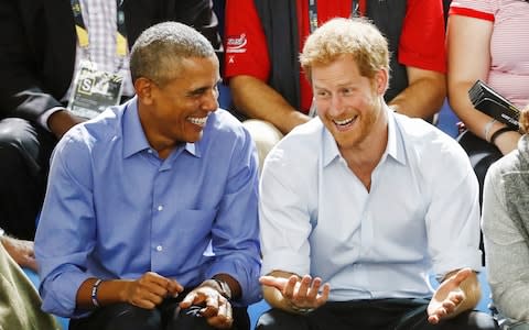 Barack Obama and Prince Harry in Toronto - Credit: Reuters