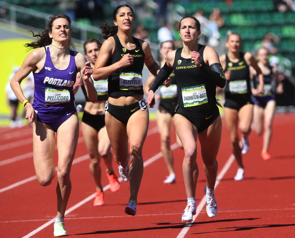 Oregon's Izzy Thornton-Bott, right, wins the women 800-meter Invitational ahead of Portland's Laura Pellicoro, left, and teammate Carly Kleefeld, center, at the Hayward Premiere at Hayward Field on Saturday.