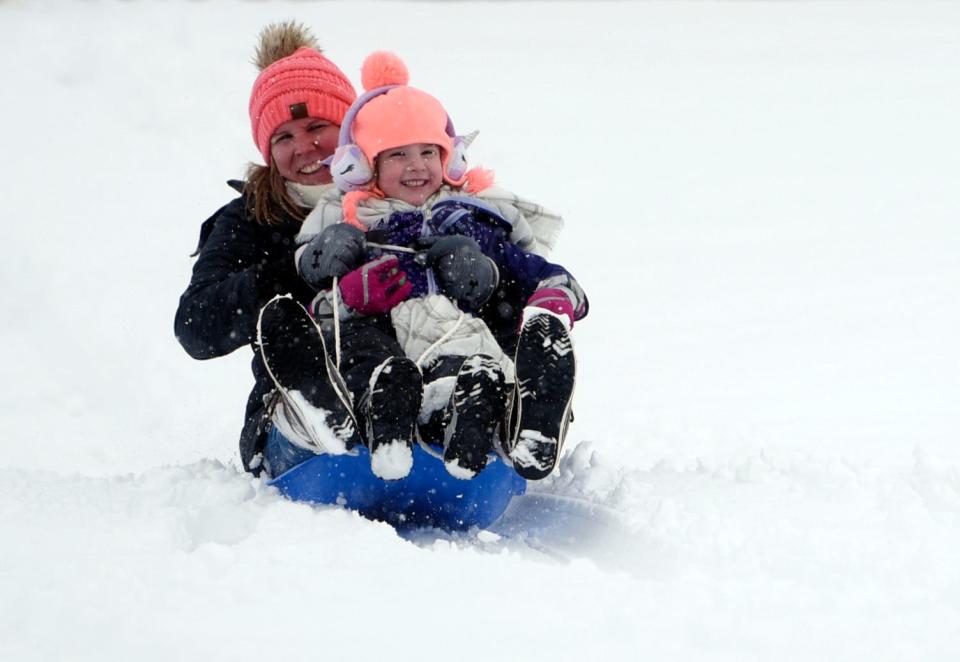 Bekah Herron, left, sleds with her four-year-old daughter Charlee, Tuesday, Jan. 24, 2023, at Mae Simmons Park. 