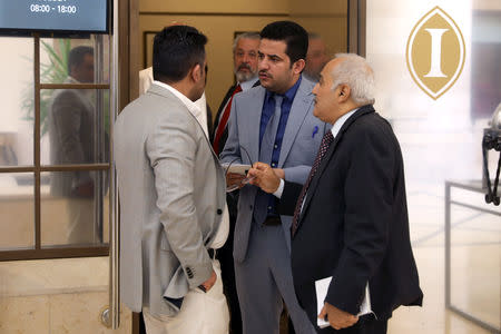 Members of the Yemeni government delegation take a break after a new round of talks between Yemen's warring parties, in Amman, Jordan May 16, 2019. REUTERS/Muhammad Hamed