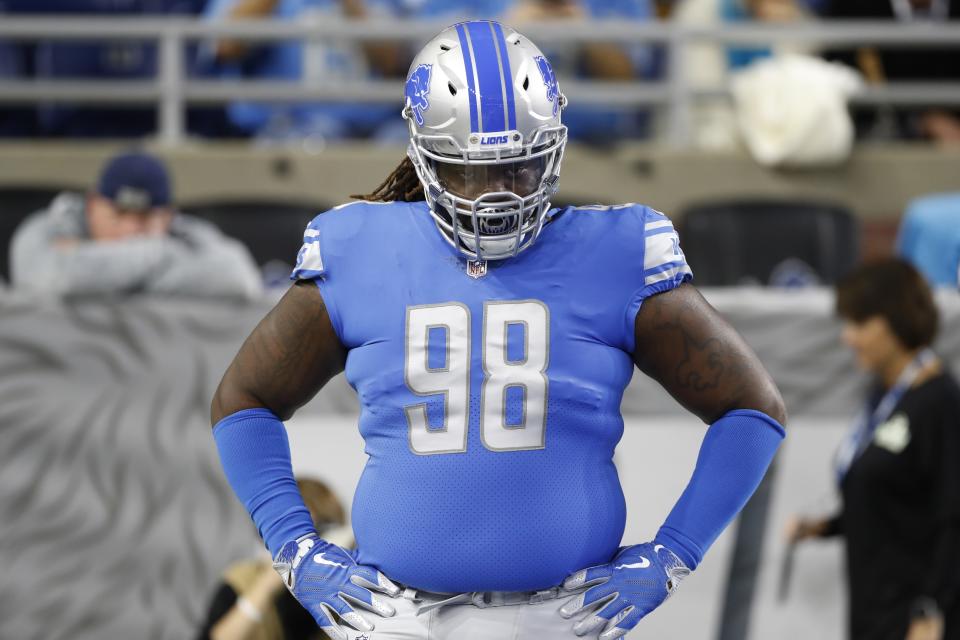 FILE - In this Oct. 28, 2018, file photo, Detroit Lions defensive tackle Damon "Snacks" Harrison is seen during pregame of an NFL football game against the Seattle Seahawks in Detroit. Detroit Lions defensive coordinator Paul Pasqualoni says cornerback Darius Slay and defensive tackle Damon "Snacks" Harrison have reported to camp. They showed up Wednesday, July 24, 2019, with their teammates, the day before Detroit’s first practice. (AP Photo/Carlos Osorio, File)